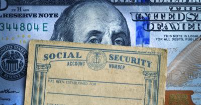 Federal reserve note behind social security card