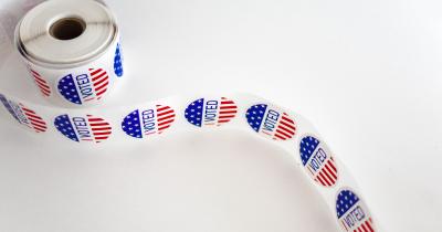 Roll of I Voted Stickers on white table