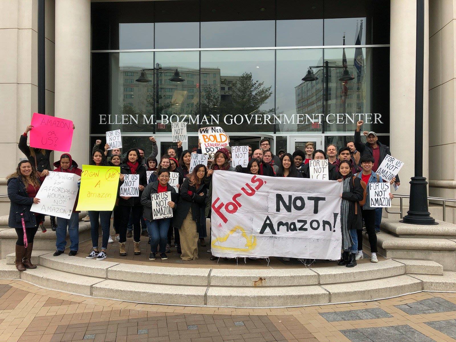 For Us, Not Amazon Coalition holding protest signs | Demos