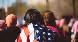 Person wrapped in American flag