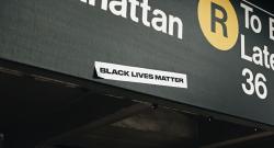 Black Lives Matter sticker on MTA subway sign