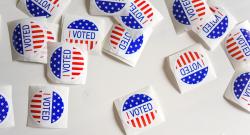 "I Voted" stickers on desk