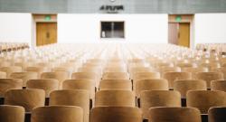 Empty chairs in a college classroom