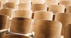 Empty seats in a classroom lecture hall at an angle