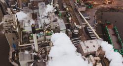 Smoke billowing from a factory plant