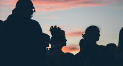 Group of people backlit at sunset
