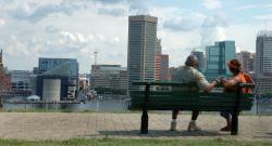 Black couple looking out at Baltimore waterfront