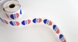 Roll of I Voted Stickers on white table