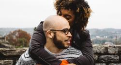 A couple of color embracing in the fall