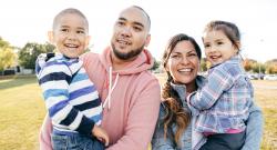 Latinx family smiling together