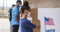 People of Color Voting With Face Masks On