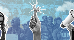 Symbols of organizing and activism in front of a group of people holding signs