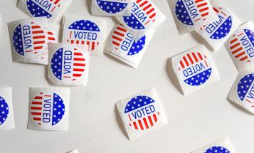 "I Voted" stickers on desk