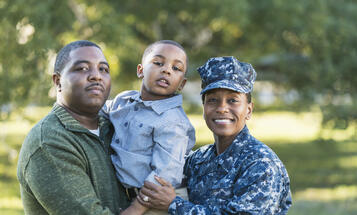 Black family smiling and posing together
