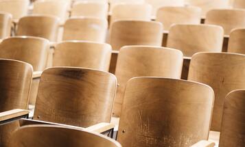 Empty seats in a classroom lecture hall at an angle