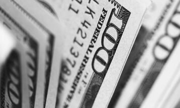 Close up of hundreds of dollars