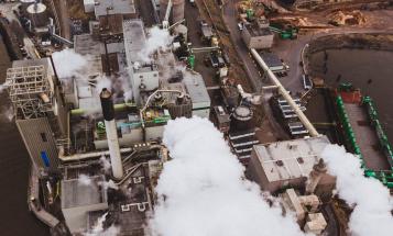 Smoke billowing from a factory plant