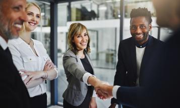 Group of workers greeting an interview job applicant