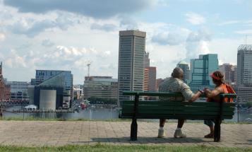 Black couple looking out at Baltimore waterfront