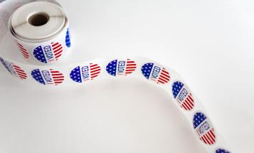 Roll of I Voted Stickers on white table