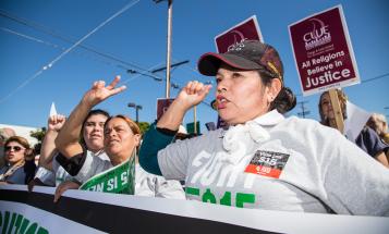 Latina Fight for $15 protestors at rally