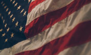 Close up of American flag in dim light