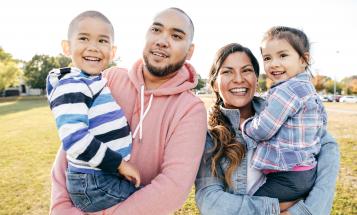Latinx family smiling together