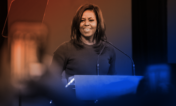 Michelle Obama speaking at a podium