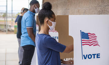 People of Color Voting With Face Masks On