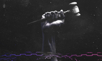 Black fist holding a gavel and breaking free of chains