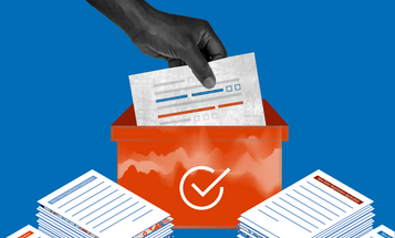 Image of a hand lowering a voter registration sheet into an orange box with stacks of voter registration papers on both sides