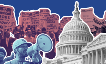 Protestors behind the Capitol Dome with an activist with a megaphone in the foreground