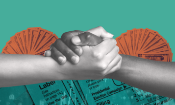 Two hands clasped in a handshake over a background featuring various United States tax forms and fanned out $100 bills.
