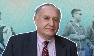 A man in a suit and tie stands in the foreground, smiling softly. In the background, a young man in a wheelchair and two people walking convey themes of support and inclusion.