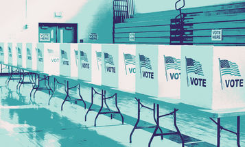 Row of  empty voting booths in a school gym