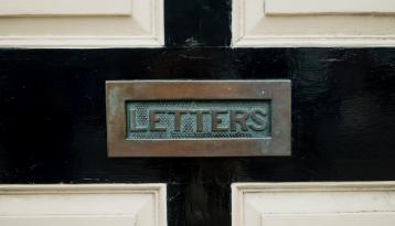Mail slot labeled letters