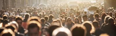 Crowd in the street with golden sunlight