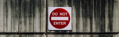 Do not enter sign on a wood fence 