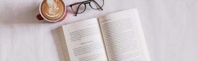 Book, latte and reading glasses