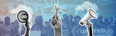Symbols of organizing and activism in front of a group of people holding signs