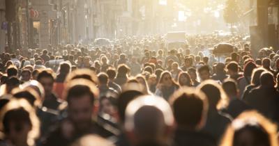 Crowd in the street with golden sunlight