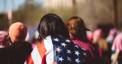 Person wrapped in American flag