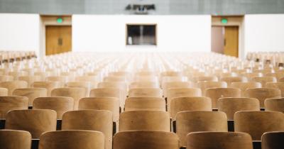 Empty chairs in a college classroom