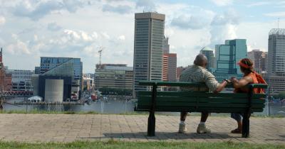 Black couple looking out at Baltimore waterfront