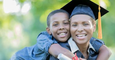 Black woman graduate and son
