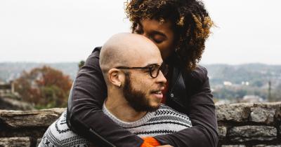 A couple of color embracing in the fall