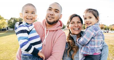 Latinx family smiling together