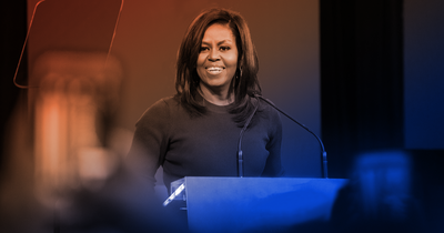 Michelle Obama speaking at a podium