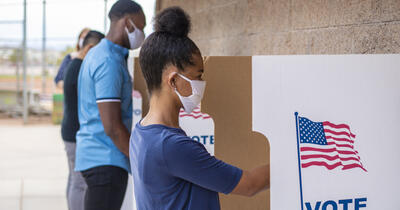 People of Color Voting With Face Masks On