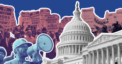 Protestors behind the Capitol Dome with an activist with a megaphone in the foreground